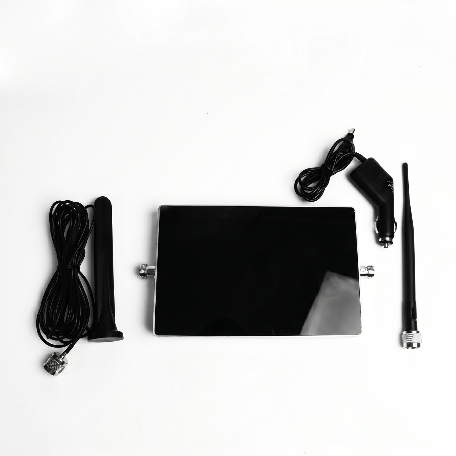 Car mobile signal booster kit with antennas and power adapter on white background